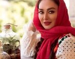 ساعت طلای الهام حمیدی با مانتوی قرمز جیغ 